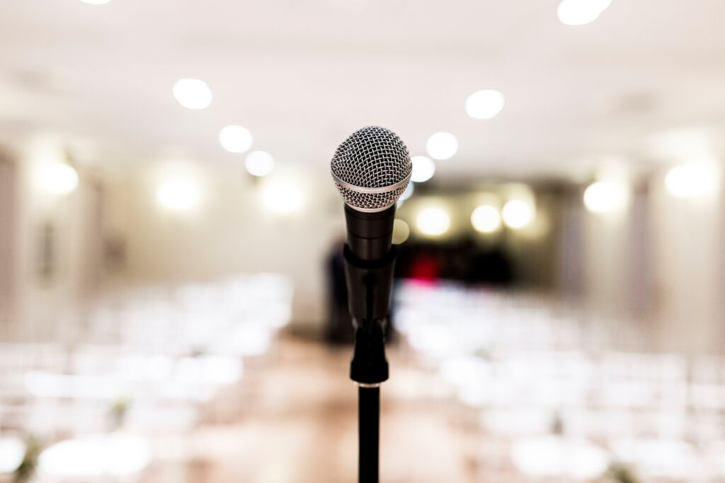 Close up old microphone in conference room. Business and company concept