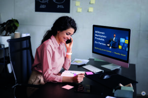 Happy businesswoman working comfortably in her office