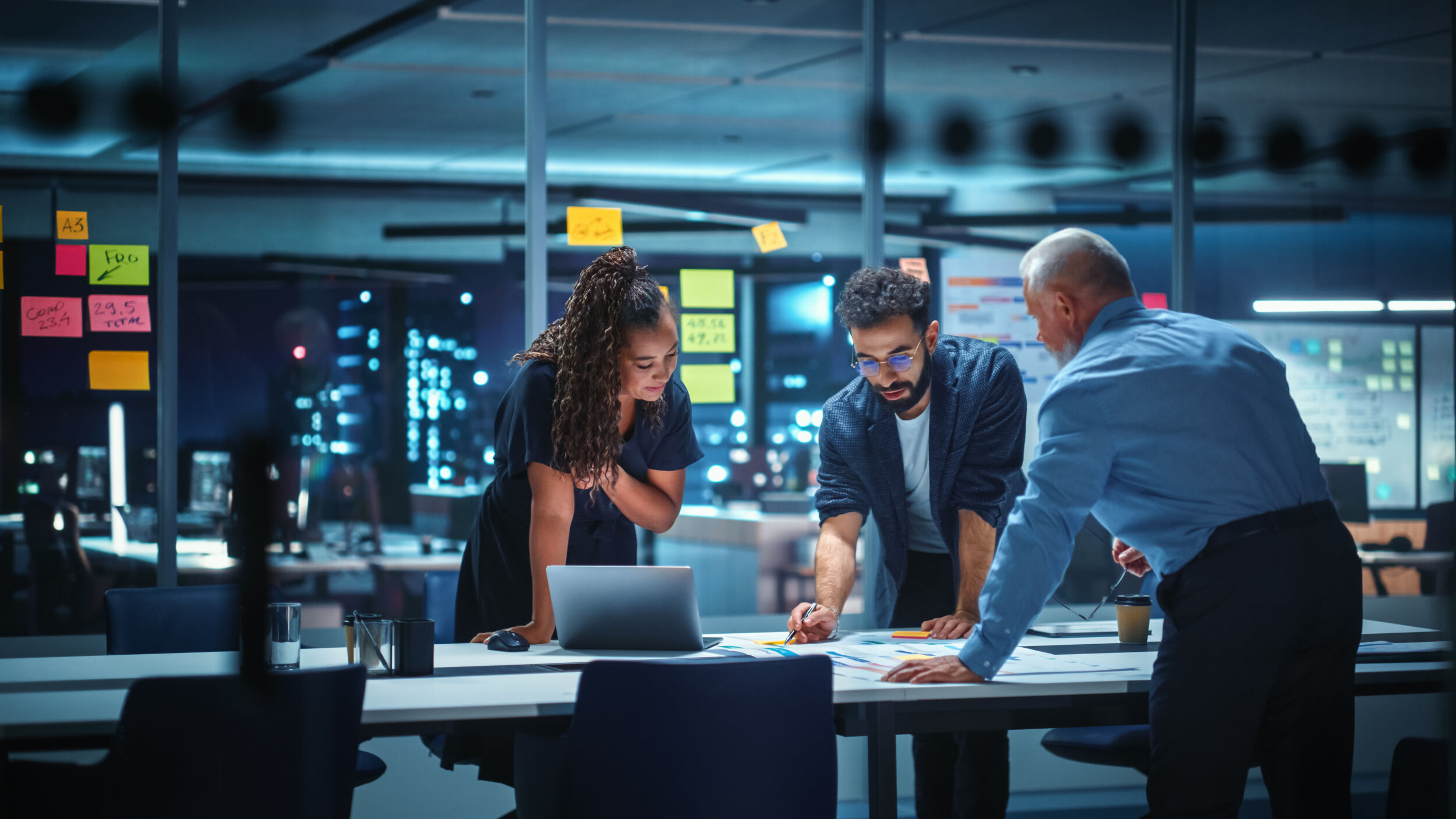 Office Conference Room Meeting Diverse Team of Top Managers Talk Brainstorm Use Digital Tablet. Business Partners Discuss Financial Reports Plan Investment Strategy. Team of Three