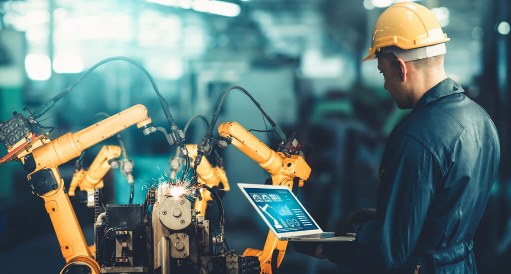 Smart industry robot arms for digital factory production technology showing automation manufacturing process of the Industry 4.0 or 4th industrial revolution and IOT software to control operation .