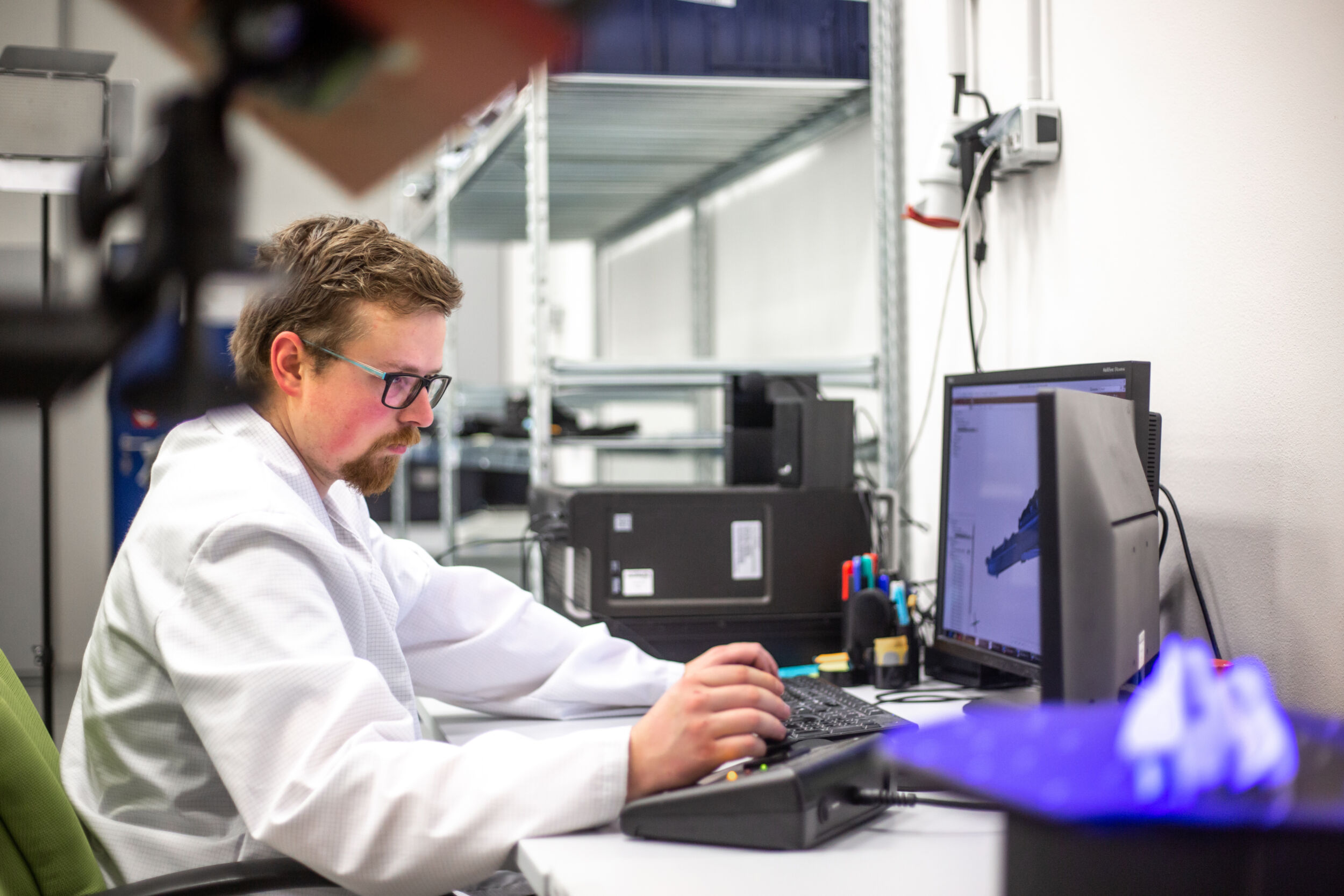 Quality engineer, metrologist scanning some moldings, components by professional optical 3D scanner with a turntable, automotive concept