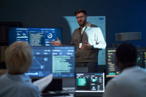 Adult Man Presenting Cybersecurity Strategy to it Team