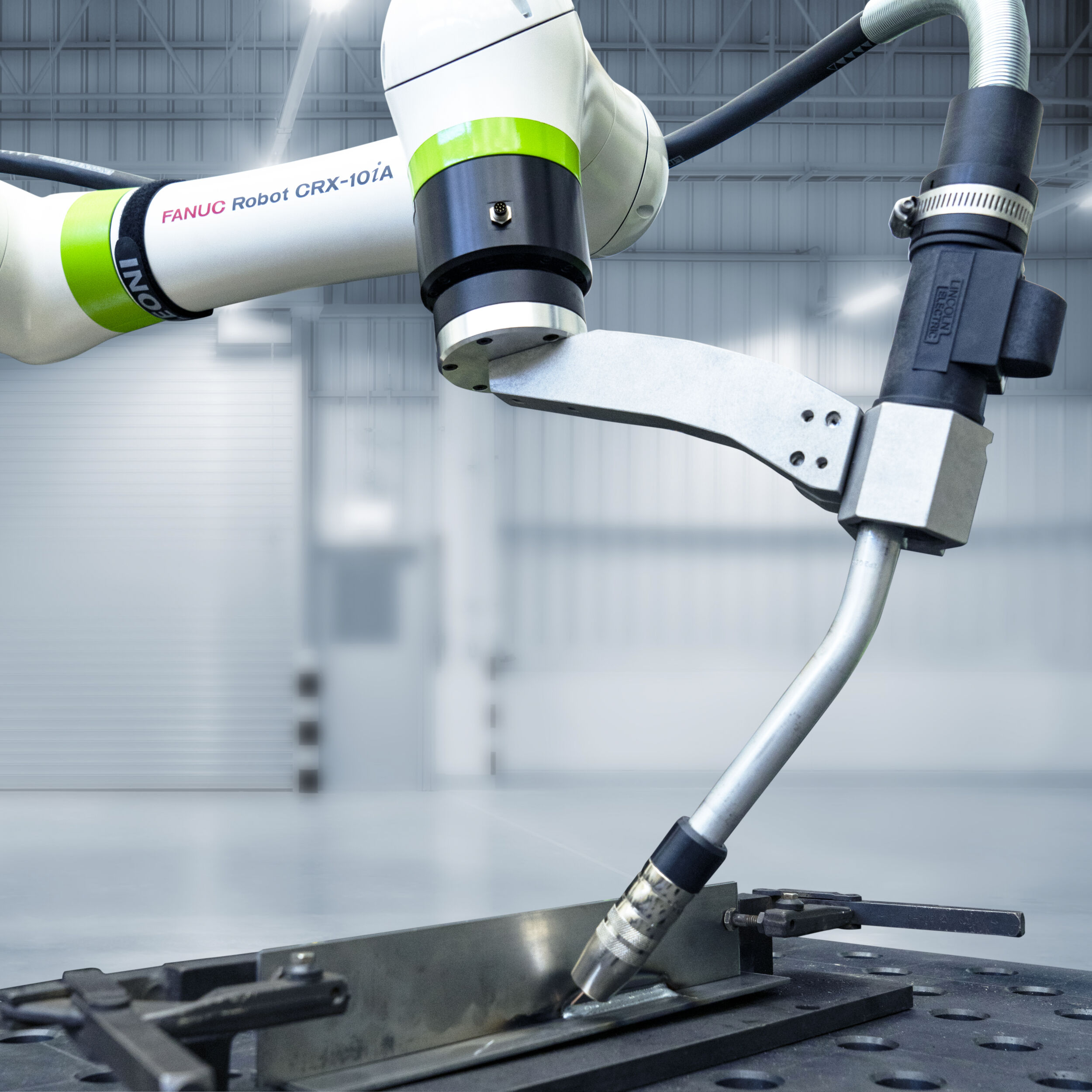 CRX-10iA with arc welding accessories (light background)