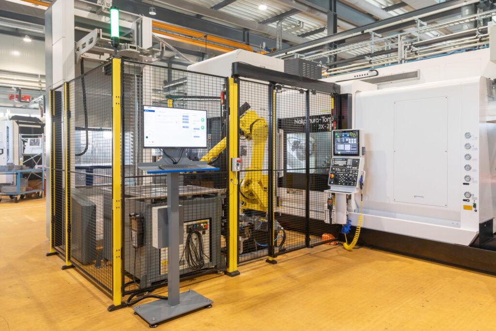 Automatisierte Maschinenbedienzelle von R. Wick im Einsatz bei Otto Hofstetter in Uznach. Sie erm&ouml;glicht die flexible Bearbeitung eines gro&szlig;en Teilespektrums - von Kleinteilen bis zu 210mm Durchmesser.