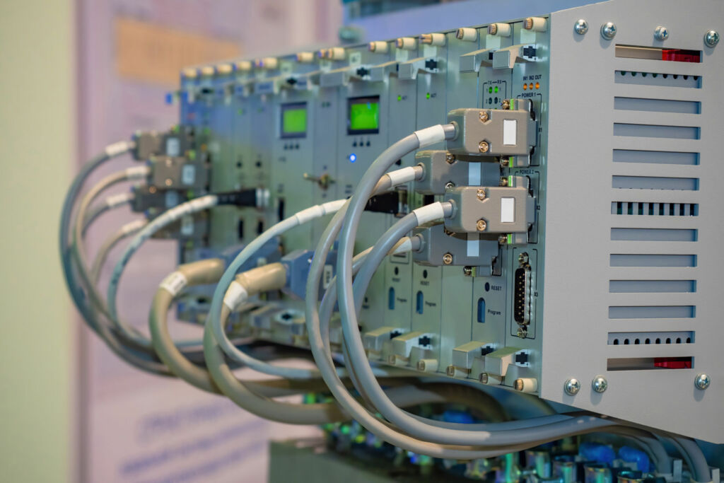 Industrial switch. Electronic equipment. Industrial technologies. Automation of industrial processes. Wires are connected to switch. Electronic equipment for factory. Factory switch.