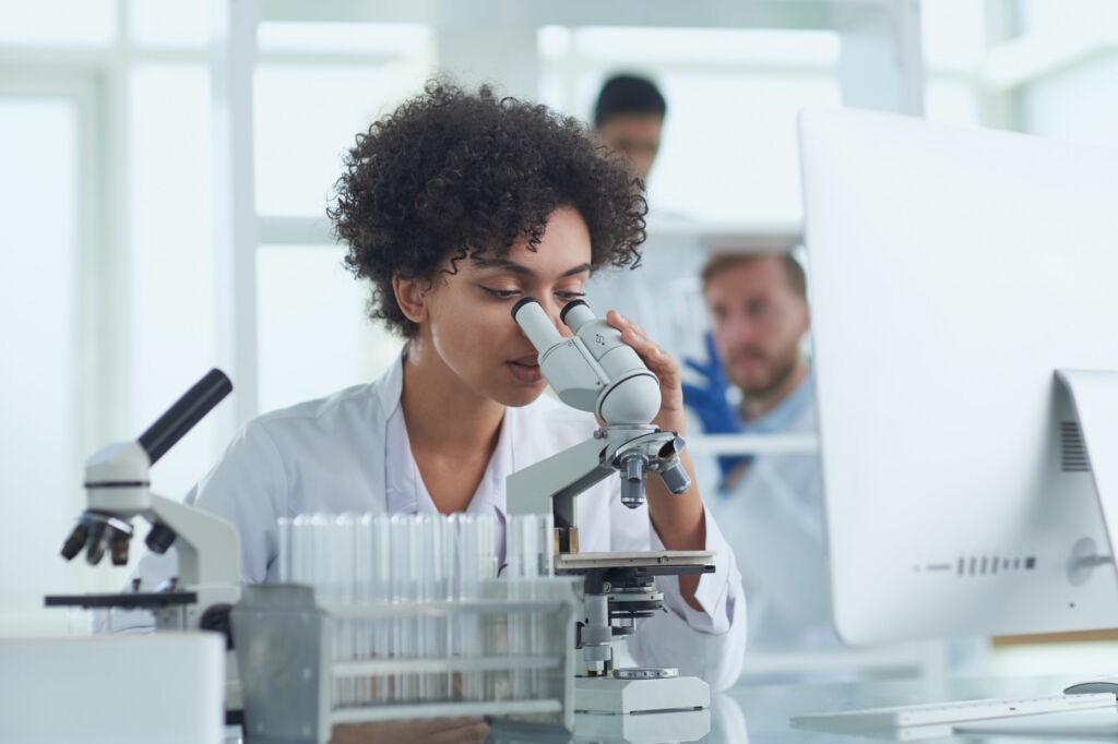 Medical Research Laboratory. Female Scientist Working with Micro