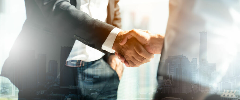 Aptean übernimmt Kieler Unternehmen Traser 1 Businessman handshake for teamwork of business merger and acquisition,successful negotiate,hand shake,two businessman shake hand with partner to celebration partnership and business deal concept