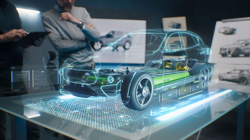 Automobilindustrie entwickelt gemeinsame Software auf Open-Source-Basis 1 Engineers using tablet with holographic innovative application