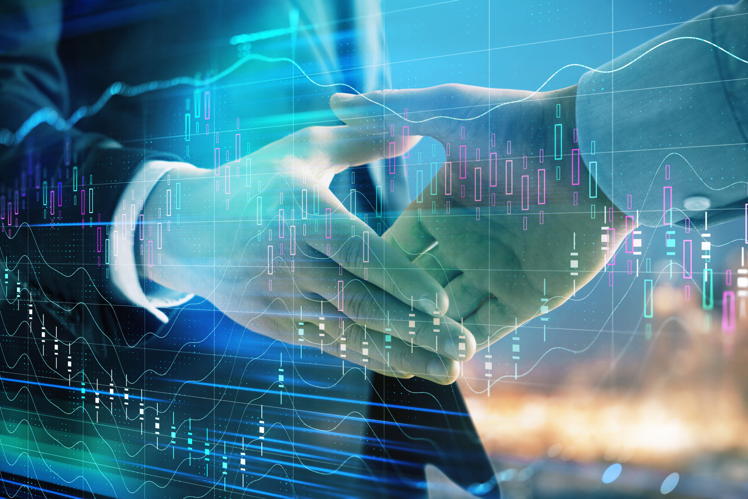 Hexagon übernimmt Waygate Technologies 23 Double exposure of financial chart on cityscape background with two businessmen handshake. Concept of financial analysis and investment opportunities
