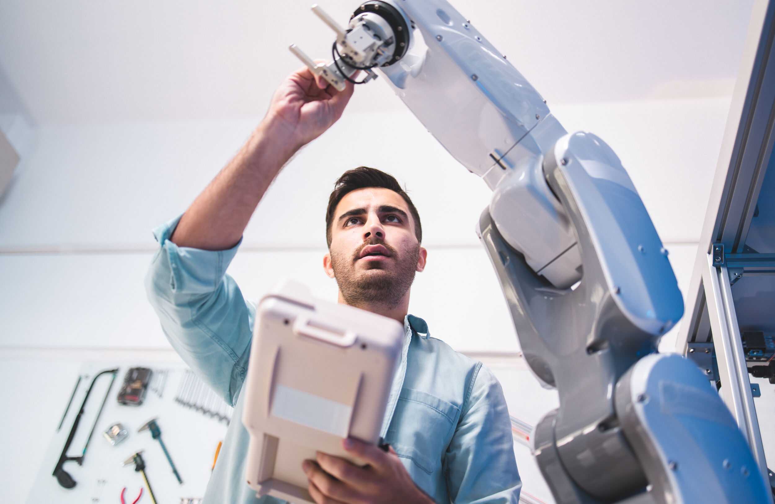 Male Engineers Maintenance Robot Arm at Lab. he are in a High Te