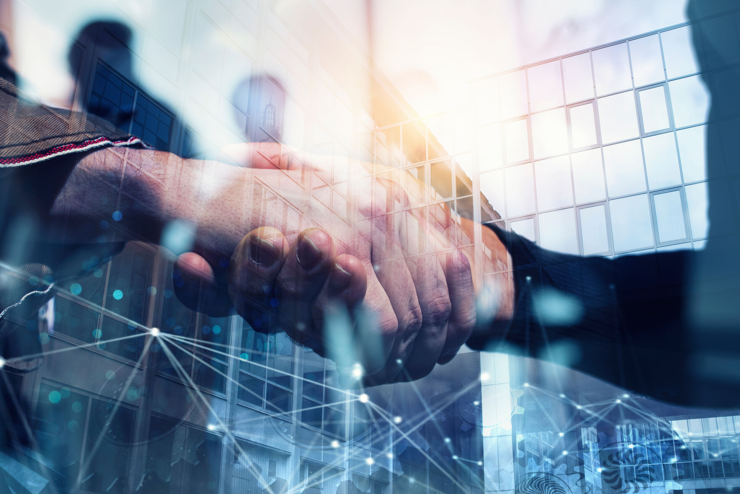 Handshaking business person in the office with network effect. concept of teamwork and partnership. double