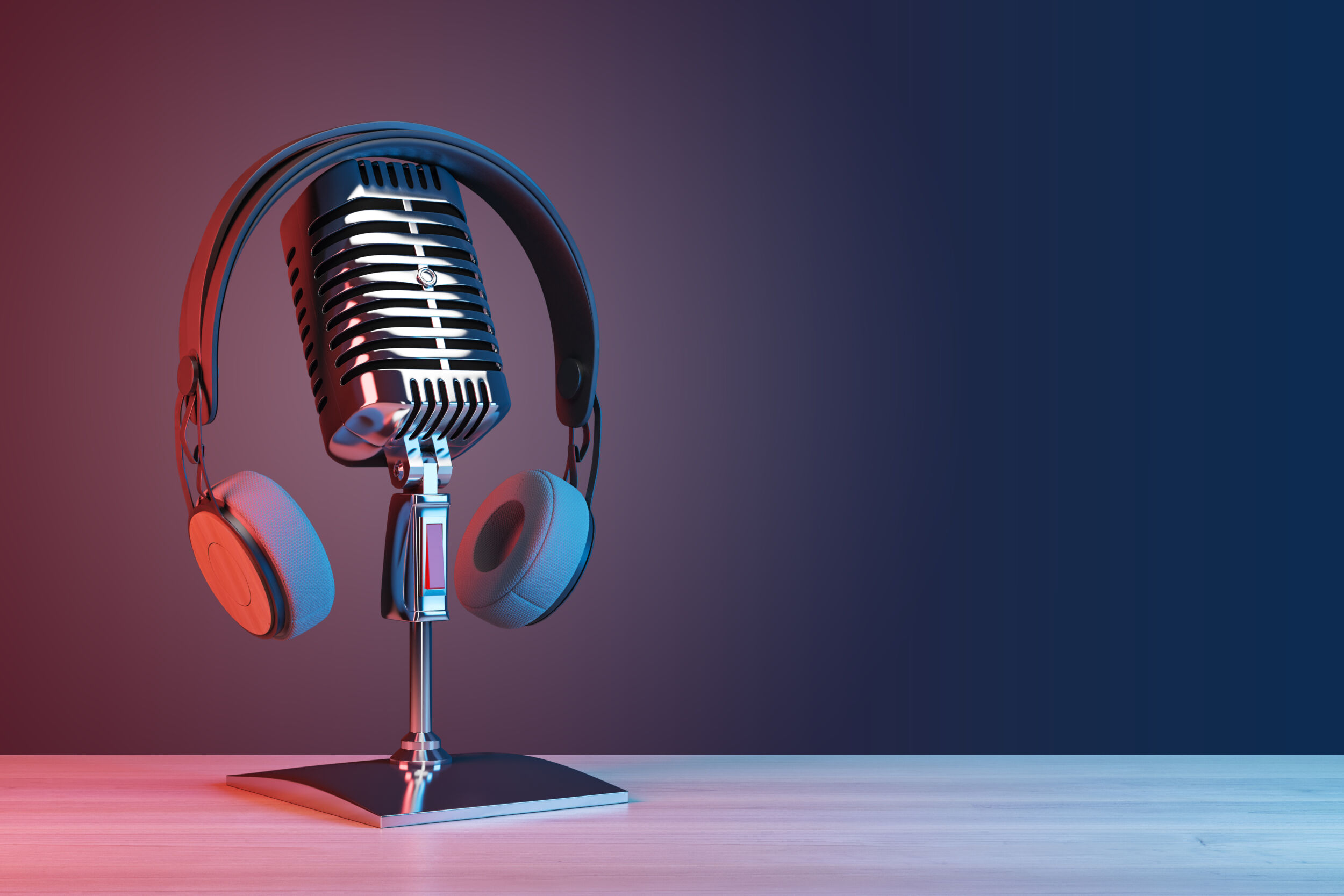 Podcasting and radio concept with retro microphone and headphones on empty wooden table and dark blank wall background with place for your logo or text. 3D rendering mock up