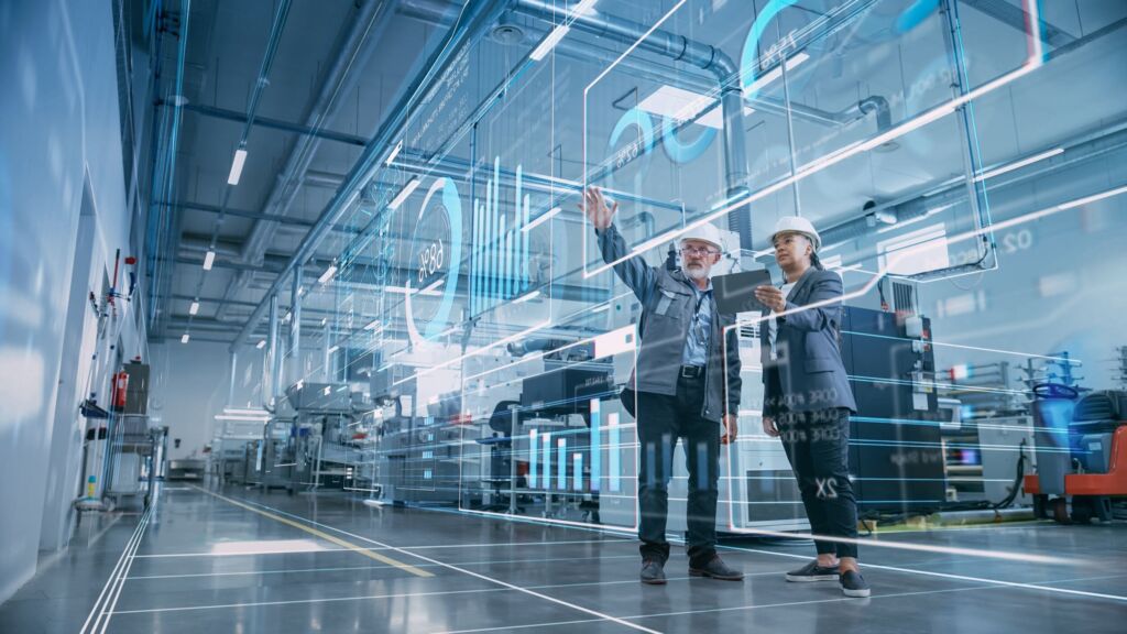 Cloud-Software mit KI-Übersetzung 2 FactoryDigitalizationTwoIndustrialEngineersUseTabletComputerVisualizeThe