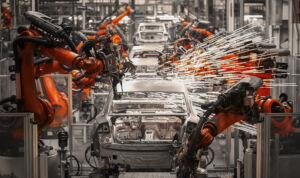 The robotic arm of the car production plant is working
