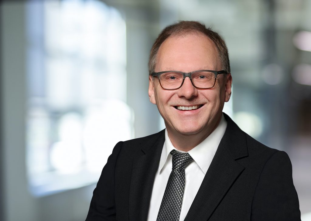 Blurred abstract grey glass wall building background. Blurred workplace. Abstract blurred workplace interior with modern glass window reflective background ;Lounge or lobby for presentation and design as banner and ads