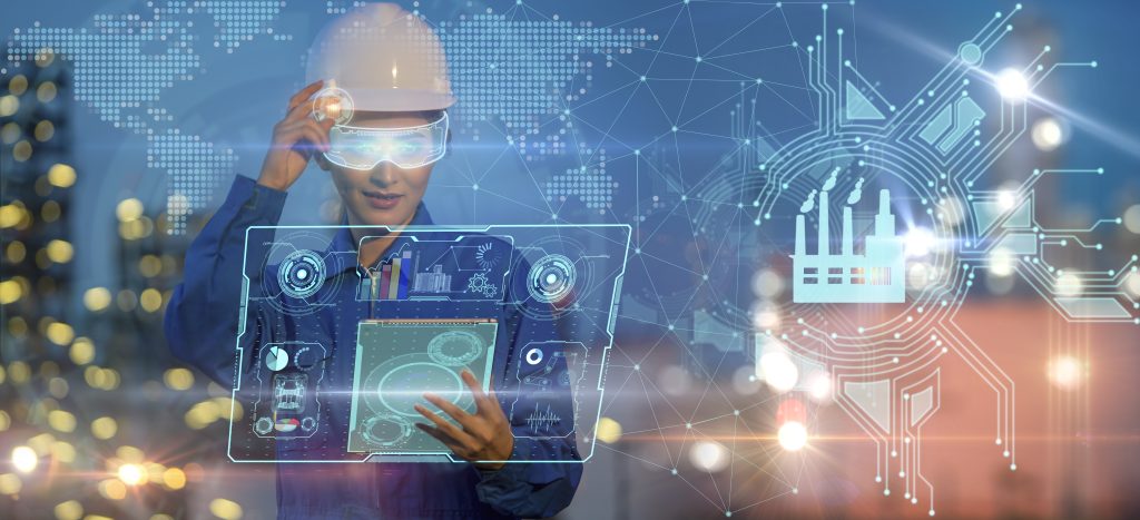 Mit Schneider Electric ins digitale Zeitalter 1 Female engineer smart industry robot arms for digital factory production technology automation manufacturing process. Industry 4.0