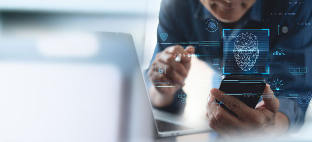 Zugang mit einem Lächeln 1 Authentication by facial recognition concept. Biometric. Security system. Business man scanning his face by smart phone to unlock and accessing personal data. Concept of data protection