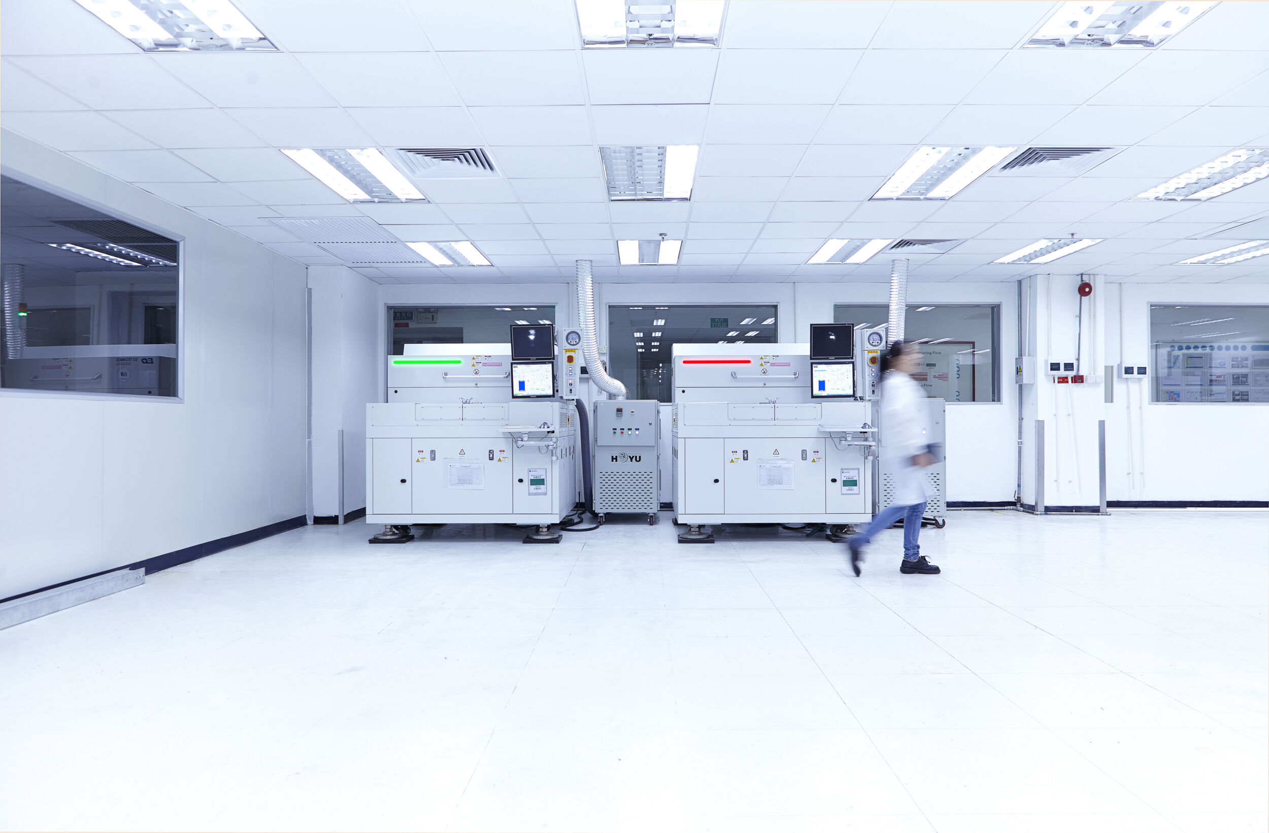 Female worker in factory producing flexible electronic circuit boards. Plant is located in the south of China in Zhuhai Guangdong province