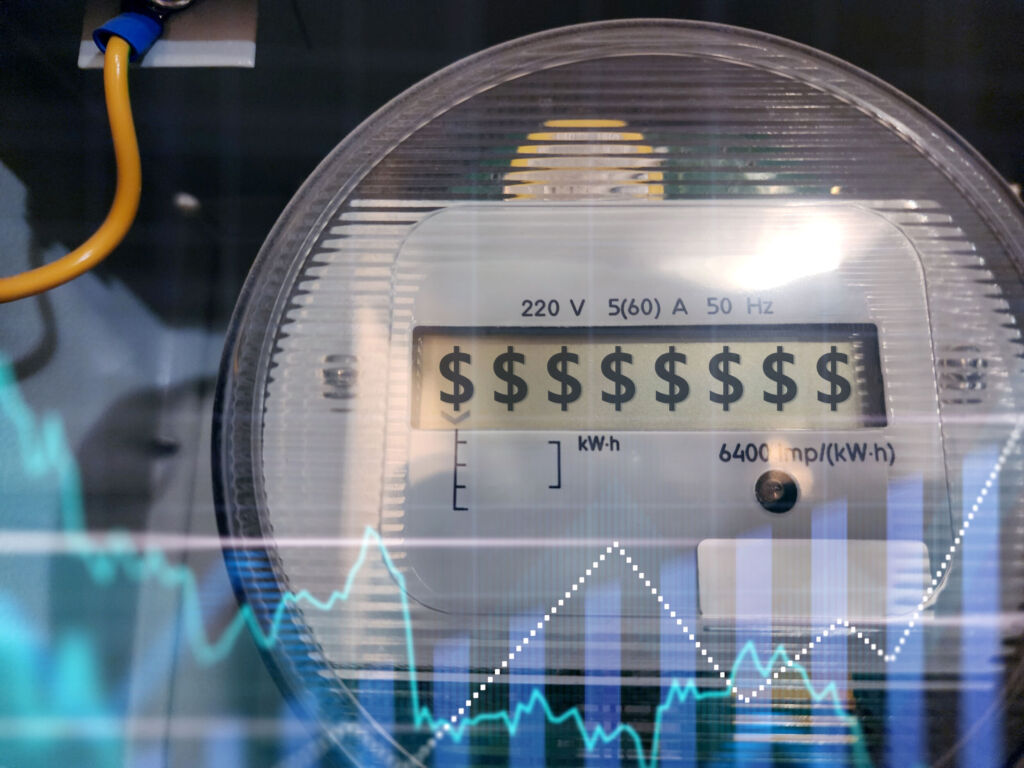 Electric counter close up. Device for metering consumed electricity. Electricity price growth chart. Increase in cost of energy resources. Electronic counter with dollar symbols on display