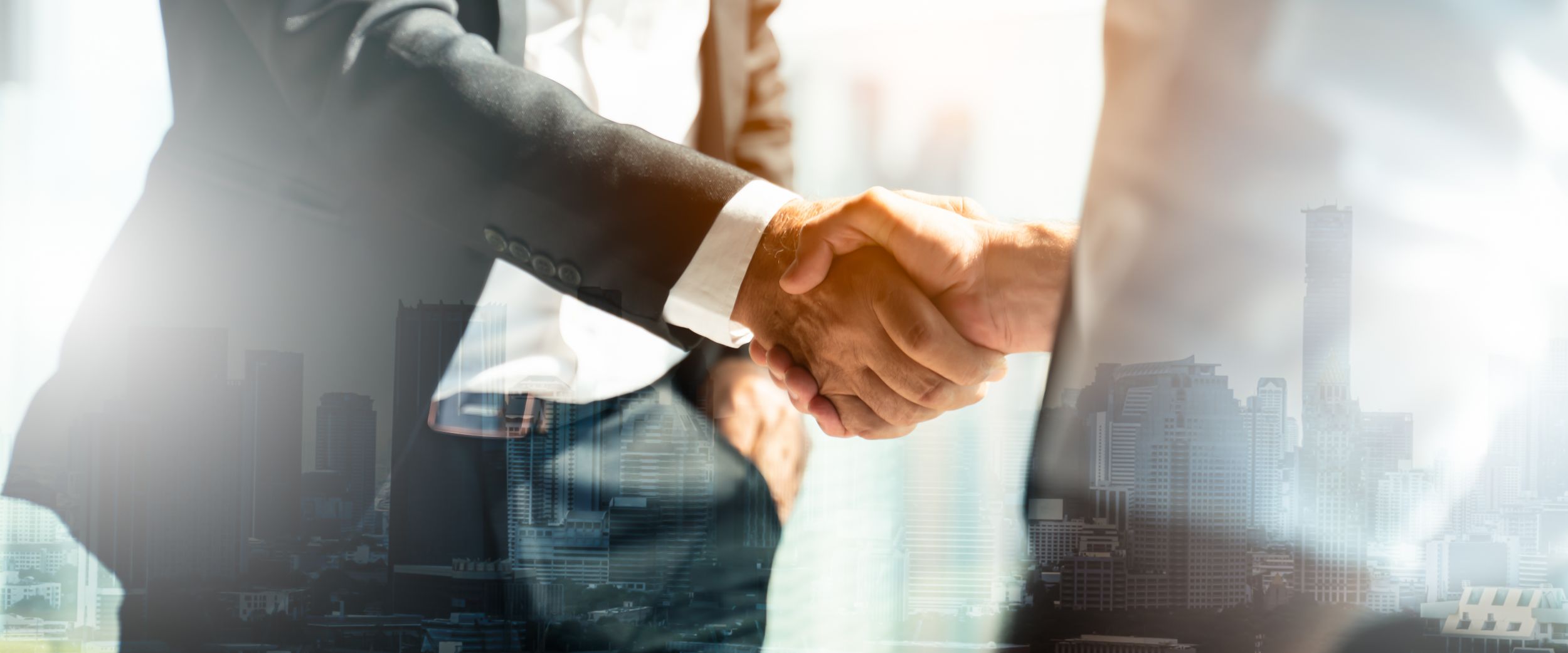 Businessman handshake for teamwork of business merger and acquisitionsuccessful negotiatehand shaketwo businessman shake hand with partner to celebration partnership and business deal concept
