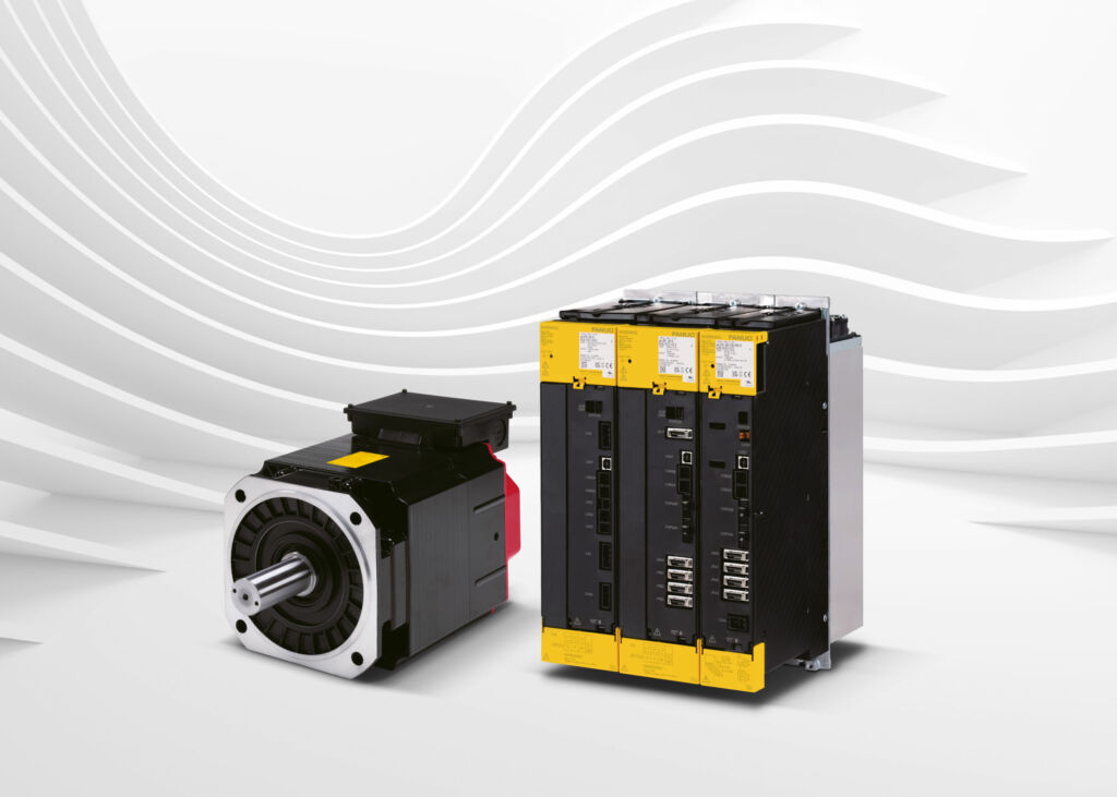 Picture of spindle motor and amplifier Alpha i-D series. Light hall background.